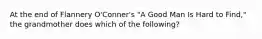 At the end of Flannery O'Conner's "A Good Man Is Hard to Find," the grandmother does which of the following?