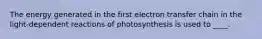 The energy generated in the first electron transfer chain in the light-dependent reactions of photosynthesis is used to ____.