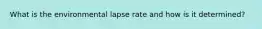 What is the environmental lapse rate and how is it determined?