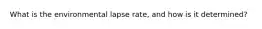 What is the environmental lapse rate, and how is it determined?