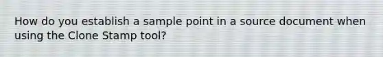 How do you establish a sample point in a source document when using the Clone Stamp tool?