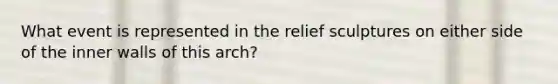 What event is represented in the relief sculptures on either side of the inner walls of this arch?