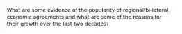What are some evidence of the popularity of regional/bi-lateral economic agreements and what are some of the reasons for their growth over the last two decades?