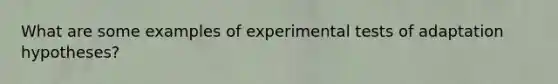 What are some examples of experimental tests of adaptation hypotheses?