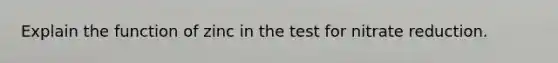 Explain the function of zinc in the test for nitrate reduction.