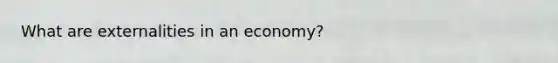 What are externalities in an economy?