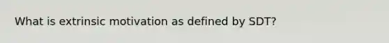 What is extrinsic motivation as defined by SDT?