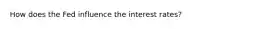 How does the Fed influence the interest rates?