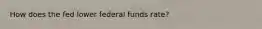 How does the fed lower federal funds rate?