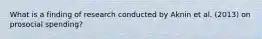 What is a finding of research conducted by Aknin et al. (2013) on prosocial spending?