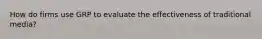 How do firms use GRP to evaluate the effectiveness of traditional media?