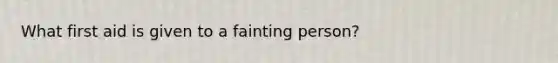 What first aid is given to a fainting person?