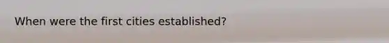 When were the first cities established?