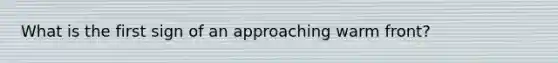 What is the first sign of an approaching warm front?