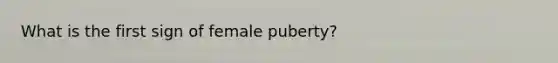 What is the first sign of female puberty?