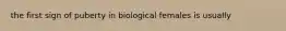 the first sign of puberty in biological females is usually