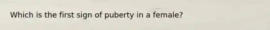 Which is the first sign of puberty in a female?​