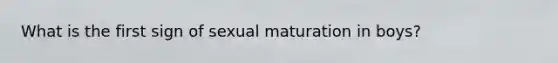 What is the first sign of sexual maturation in boys?