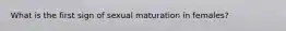 What is the first sign of sexual maturation in females?