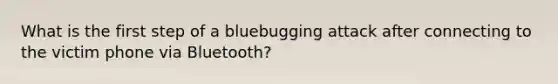 What is the first step of a bluebugging attack after connecting to the victim phone via Bluetooth?