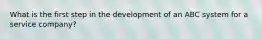 What is the first step in the development of an ABC system for a service company?