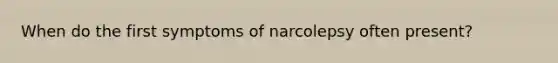 When do the first symptoms of narcolepsy often present?