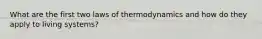 What are the first two laws of thermodynamics and how do they apply to living systems?