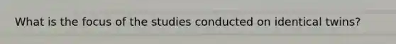 What is the focus of the studies conducted on identical twins?