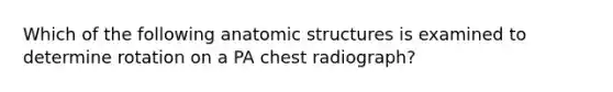 Which of the following anatomic structures is examined to determine rotation on a PA chest radiograph?