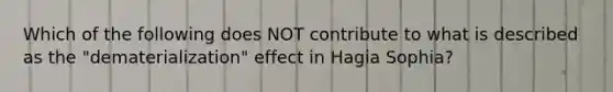 Which of the following does NOT contribute to what is described as the "dematerialization" effect in Hagia Sophia?