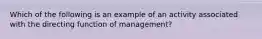 Which of the following is an example of an activity associated with the directing function of management?