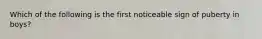 Which of the following is the first noticeable sign of puberty in boys?