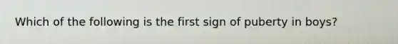 Which of the following is the first sign of puberty in boys?