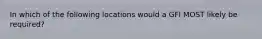 In which of the following locations would a GFI MOST likely be required?