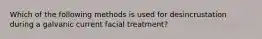 Which of the following methods is used for desincrustation during a galvanic current facial treatment?