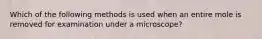 Which of the following methods is used when an entire mole is removed for examination under a microscope?