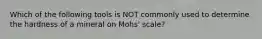 Which of the following tools is NOT commonly used to determine the hardness of a mineral on Mohs' scale?