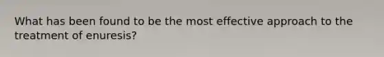 What has been found to be the most effective approach to the treatment of enuresis?
