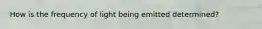 How is the frequency of light being emitted determined?