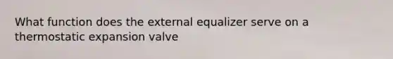 What function does the external equalizer serve on a thermostatic expansion valve