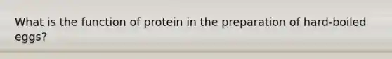 What is the function of protein in the preparation of hard-boiled eggs?