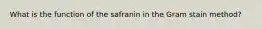 What is the function of the safranin in the Gram stain method?