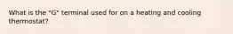 What is the "G" terminal used for on a heating and cooling thermostat?