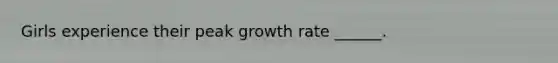 Girls experience their peak growth rate ______.