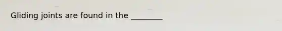 Gliding joints are found in the ________