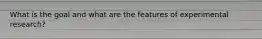 What is the goal and what are the features of experimental research?