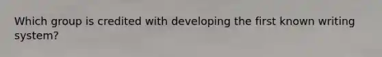 Which group is credited with developing the first known writing system?