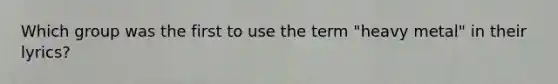 Which group was the first to use the term "heavy metal" in their lyrics?