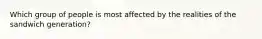 Which group of people is most affected by the realities of the sandwich generation?