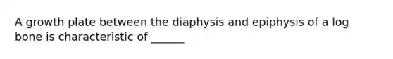 A growth plate between the diaphysis and epiphysis of a log bone is characteristic of ______